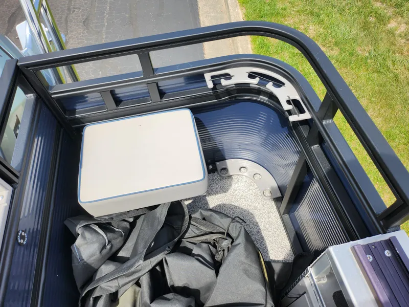 Slide: The Image of 2023 Qwest 8522 Pro Family Fish boat storage area with bags and equipment. - 20