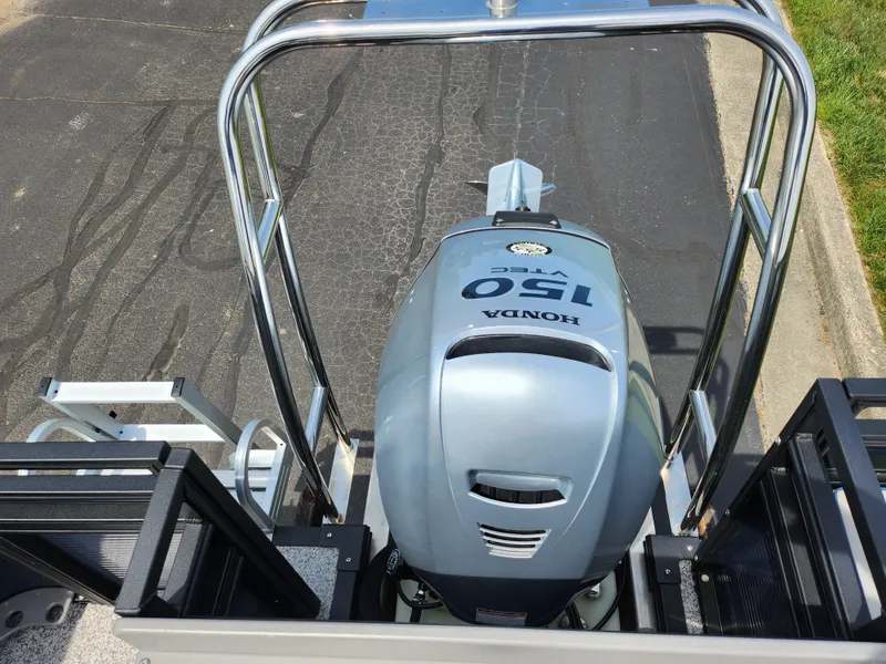 Slide: The Image of 2023 Qwest 8522 Pro Family Fish boat with Honda 150 outboard motor, rear view. - 23