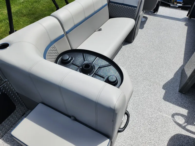 Slide: The Image of 2023 Qwest 8522 Pro Family Fish boat interior with gray seating and circular table. - 25