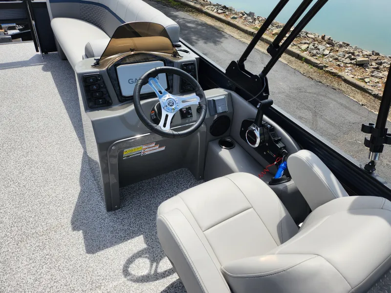 Slide: The Image of 2023 Qwest 8522 Pro Family Fish boat interior with steering wheel and seating. - 26