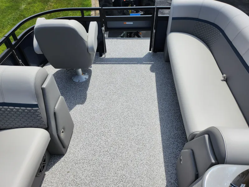 Slide: The Image of 2023 Qwest 8522 Pro Family Fish boat interior with gray seating and carpeted floor. - 29