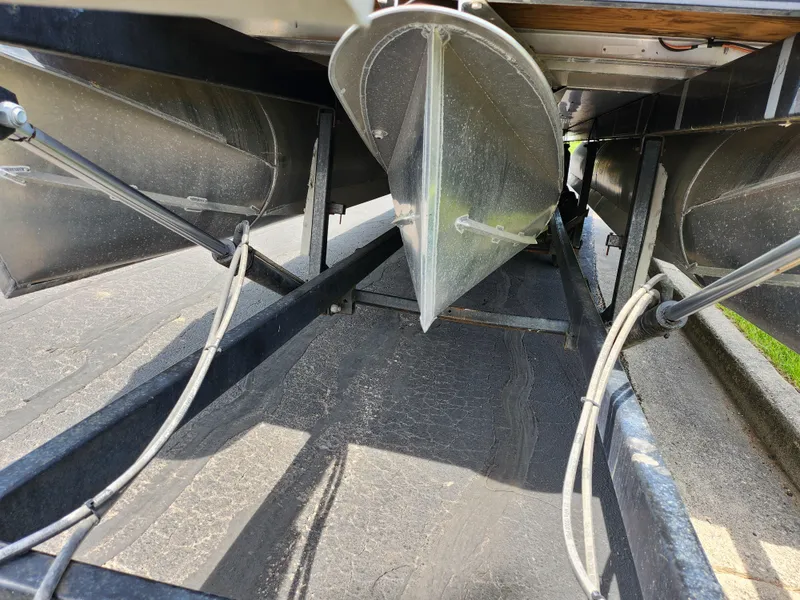 Slide: The Image of Underneath view of 2023 Qwest 8522 Pro Family Fish pontoon boat, showcasing pontoons and structure. - 7