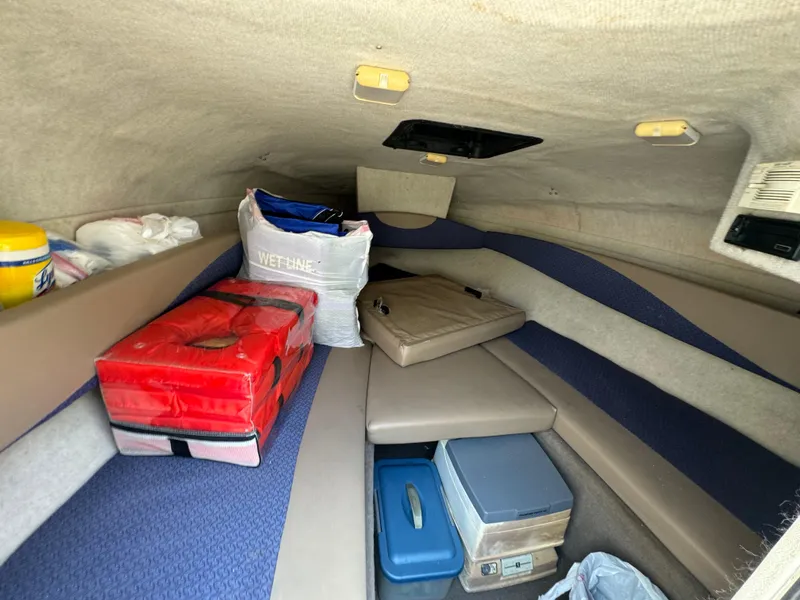 Slide: The Image of Interior cabin of a 2003 Bayliner 212 boat with storage items. - 7
