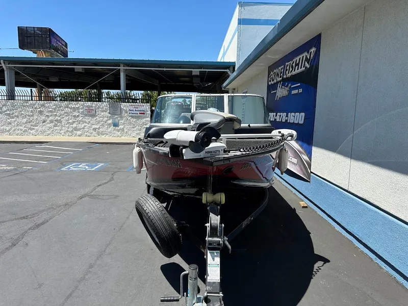 Slide: The Image of 2020 Alumacraft Classic 165 boat on trailer in parking lot. - 13