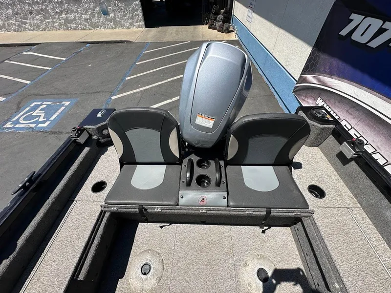 Slide: The Image of 2020 Alumacraft Classic 165 boat interior with dual seats and motor. - 14