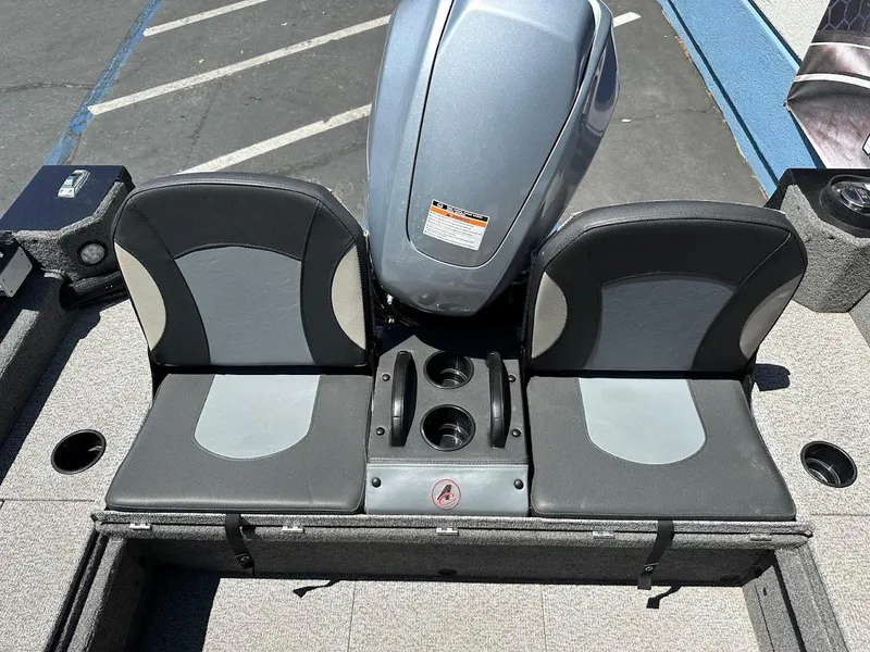 Slide: The Image of 2020 Alumacraft Classic 165 boat seats with motor, featuring dual cup holders. - 15