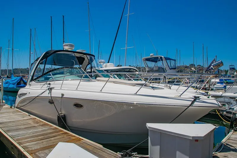 Slide: The Image of 2007 Chaparral Signature 310 boat docked at marina under clear blue sky. - 1