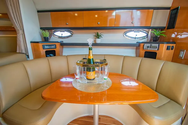 Slide: The Image of Luxurious 2007 Chaparral Signature 310 yacht interior with champagne and elegant seating. - 15