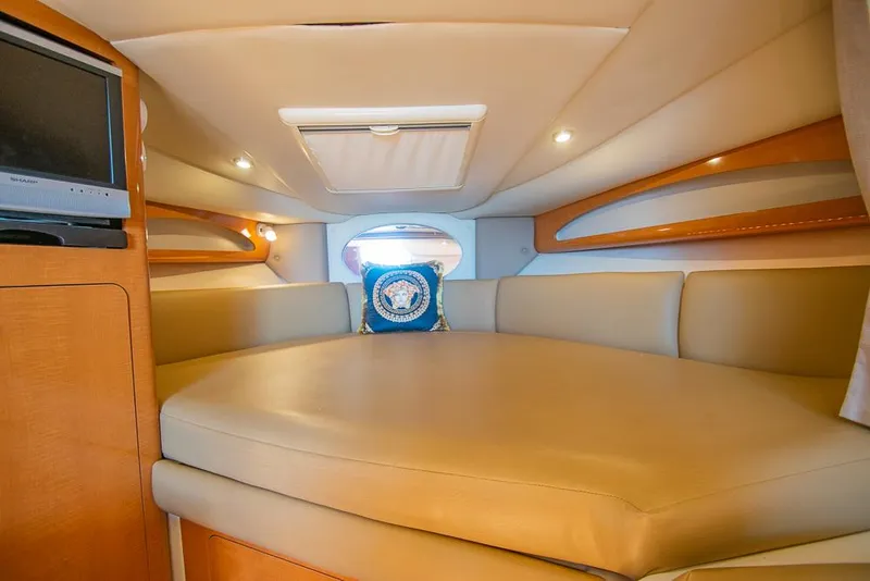 Slide: The Image of Interior of 2007 Chaparral Signature 310 boat with cozy seating and a small TV. - 18