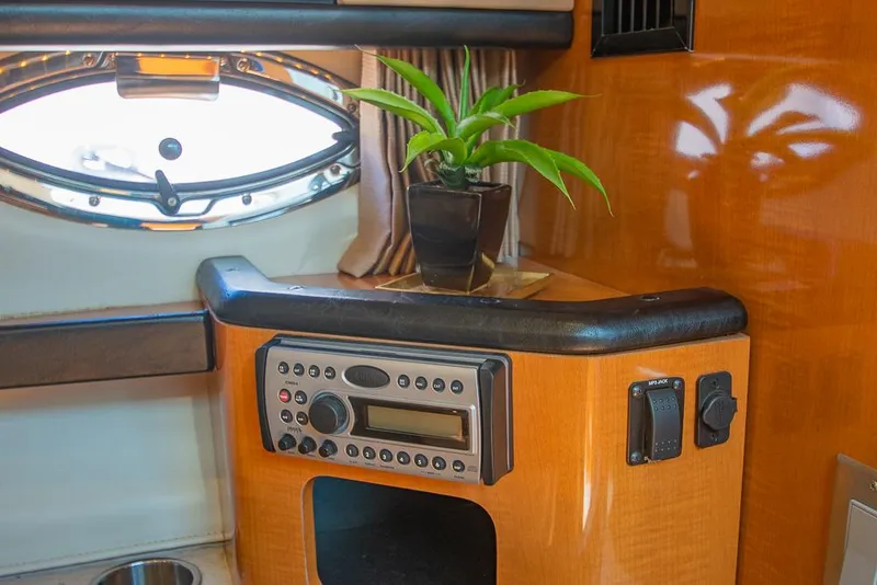 Slide: The Image of 2007 Chaparral Signature 310 cabin interior with radio and porthole. - 21