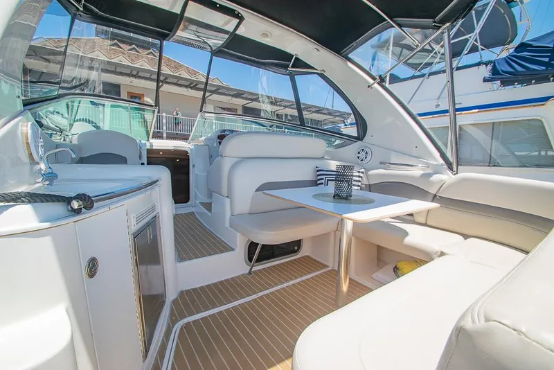 Slide: The Image of 2007 Chaparral Signature 310 boat interior with seating and table, featuring modern design elements. - 26