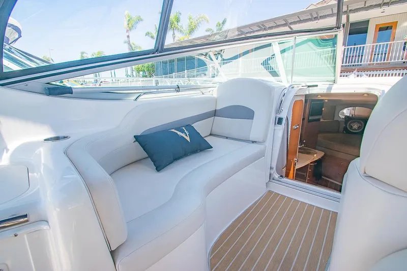 Slide: The Image of 2007 Chaparral Signature 310 boat interior with plush seating and cabin view. - 27