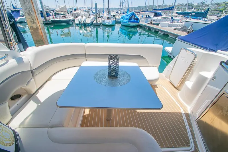 Slide: The Image of 2007 Chaparral Signature 310 yacht interior with seating and table at marina. - 28
