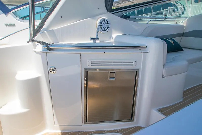 Slide: The Image of 2007 Chaparral Signature 310 boat interior with kitchenette and seating area. - 30