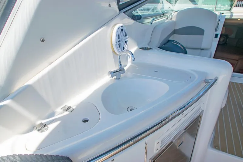 Slide: The Image of 2007 Chaparral Signature 310 boat interior with sink and seating area. - 31