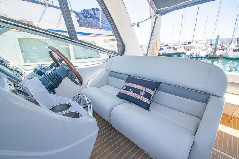 Slide: The Image of 2007 Chaparral Signature 310 boat interior with plush seating and steering wheel. - 34