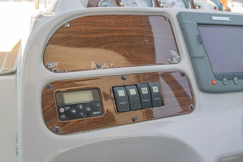 Slide: The Image of Control panel of 2007 Chaparral Signature 310 boat with switches and display. - 37