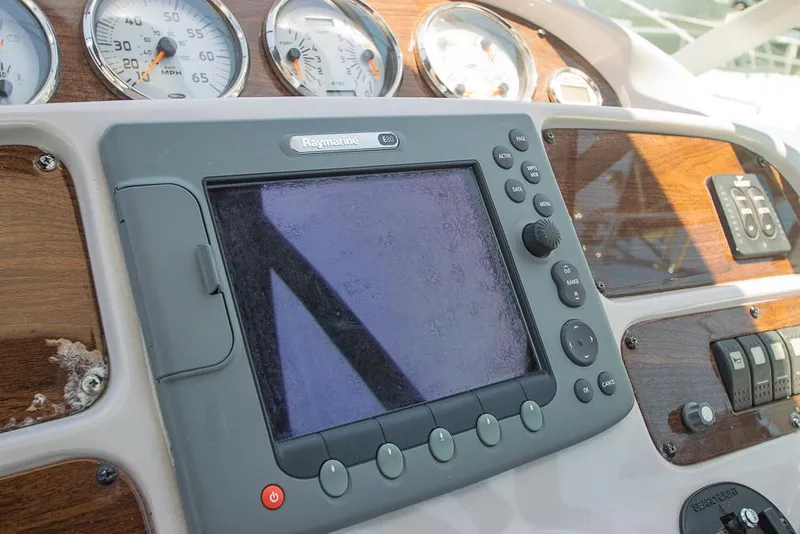 Slide: The Image of Dashboard of 2007 Chaparral Signature 310 with navigation system and gauges. - 38