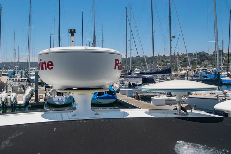Slide: The Image of 2007 Chaparral Signature 310 with radar, docked in a marina with sailboats. - 40