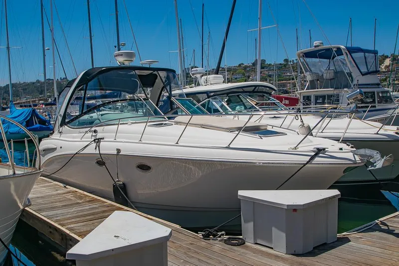 Slide: The Image of 2007 Chaparral Signature 310 boat docked at a marina on a sunny day. - 5