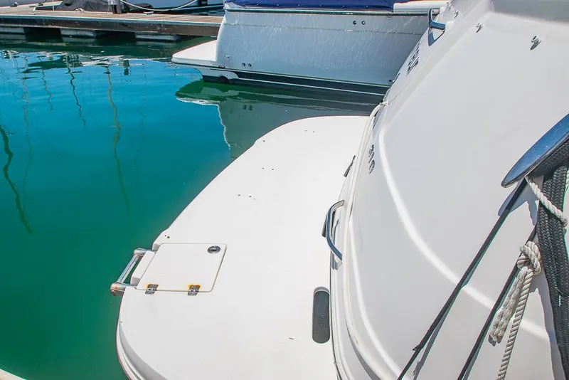 Slide: The Image of 2007 Chaparral Signature 310 boat docked in marina, rear view. - 7
