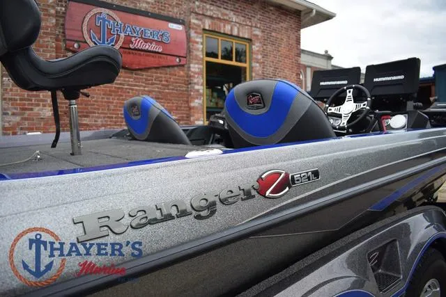 Slide: The Image of 2021 Ranger Z521L boat at Thayer's Marine dealership, featuring sleek design and branding. - 11