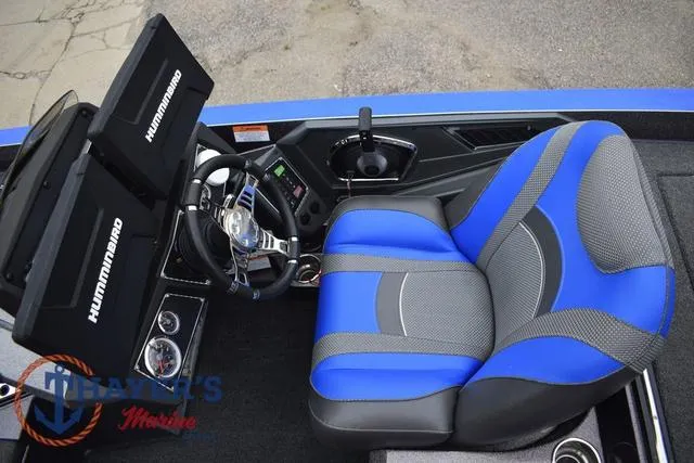 Slide: The Image of 2021 Ranger Z521L boat cockpit with blue seat and dual Humminbird displays. - 16