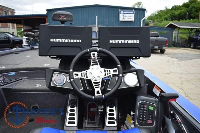 Slide: The Image of 2021 Ranger Z521L boat dashboard with dual Humminbird displays and steering wheel. - 17