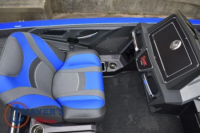 Slide: The Image of 2021 Ranger Z521L boat interior with blue and gray seating and dashboard. - 20