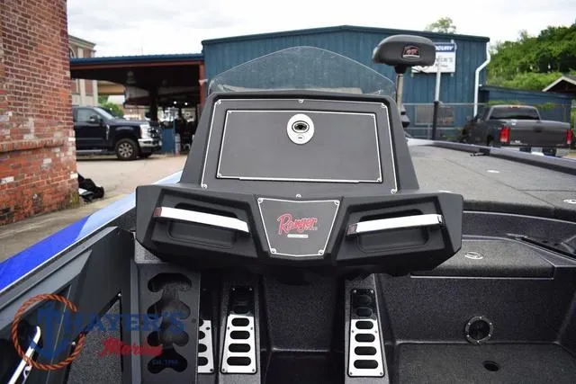 Slide: The Image of 2021 Ranger Z521L boat dashboard with steering wheel and control panel. - 21