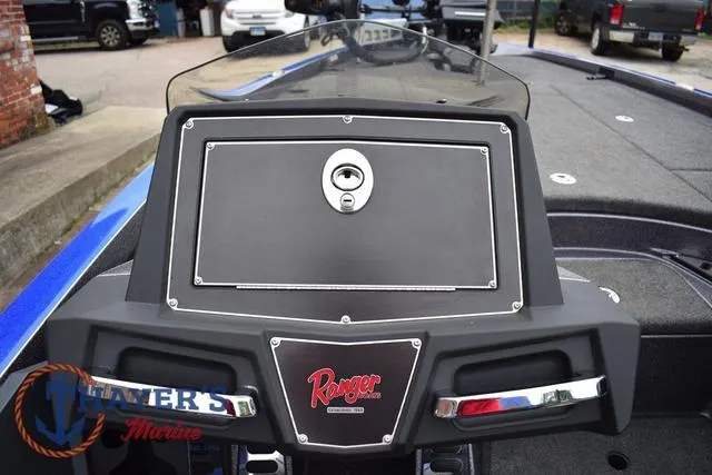 Slide: The Image of 2021 Ranger Z521L boat dashboard with logo and storage compartment. - 23