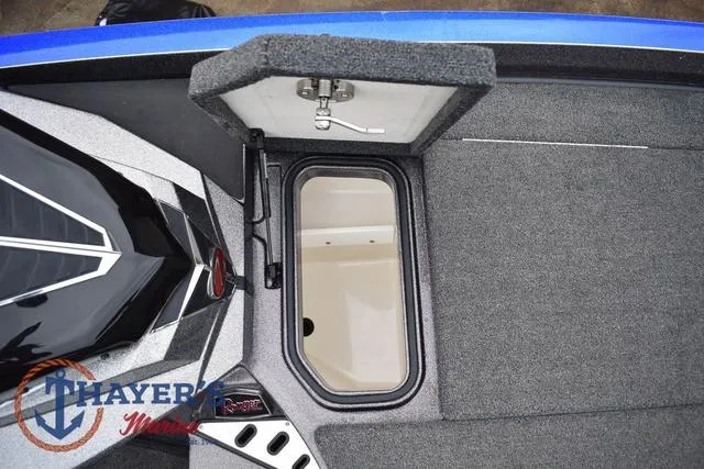 Slide: The Image of 2021 Ranger Z521L boat storage compartment with open hatch, featuring Thayer Marine logo. - 29