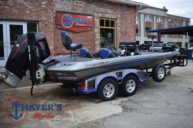 Slide: The Image of 2021 Ranger Z521L boat on trailer at Thayer's Marine dealership. - 3