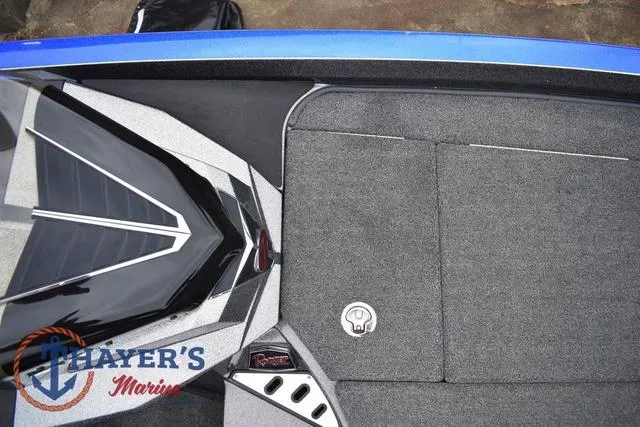Slide: The Image of 2021 Ranger Z521L boat interior with gray carpet and Thayer's Marine logo. - 30