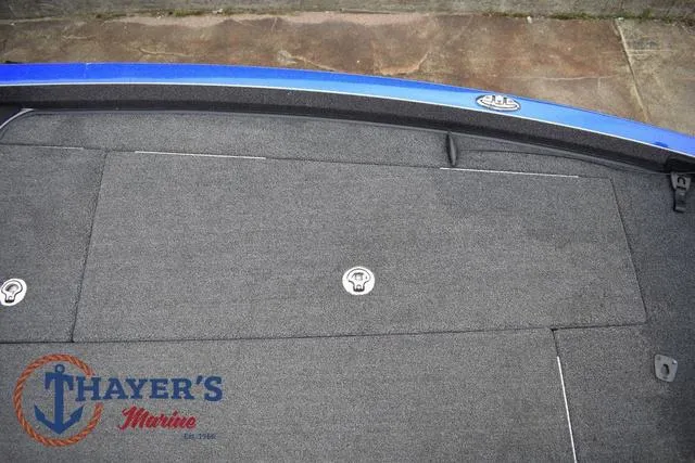 Slide: The Image of 2021 Ranger Z521L boat deck with Thayer's Marine logo, featuring storage compartments. - 31