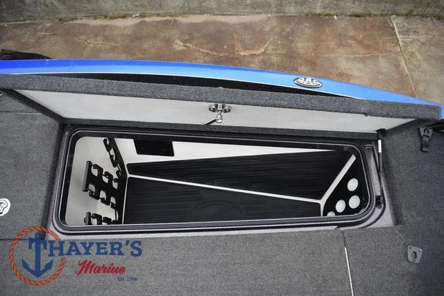 Slide: The Image of 2021 Ranger Z521L boat storage compartment with Thayer's Marine logo. - 32