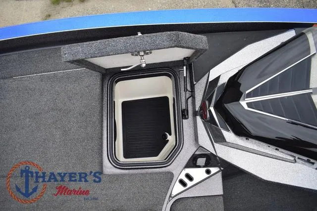 Slide: The Image of 2021 Ranger Z521L boat interior with storage compartment, Thayer's Marine logo visible. - 34