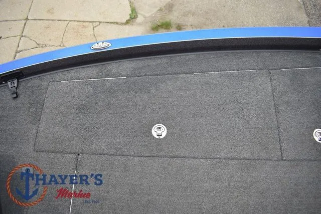 Slide: The Image of 2021 Ranger Z521L boat deck with Thayer's Marine logo, featuring storage compartments. - 35