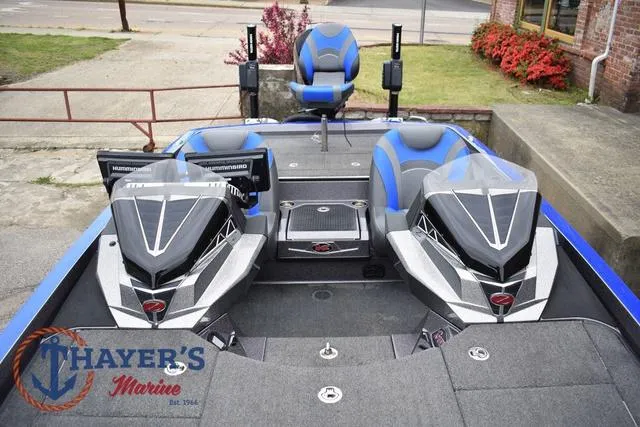 Slide: The Image of 2021 Ranger Z521L boat interior with dual seats and Thayer's Marine logo. - 40