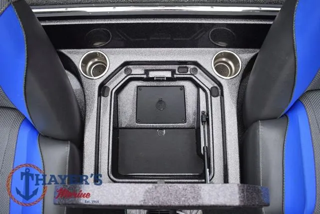 Slide: The Image of 2021 Ranger Z521L boat interior with cup holders and storage compartment. - 42