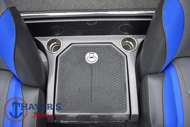 Slide: The Image of 2021 Ranger Z521L boat interior with cup holders and storage compartment. - 43
