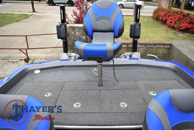 Slide: The Image of 2021 Ranger Z521L boat deck with blue seats and Thayer's Marine logo. - 44