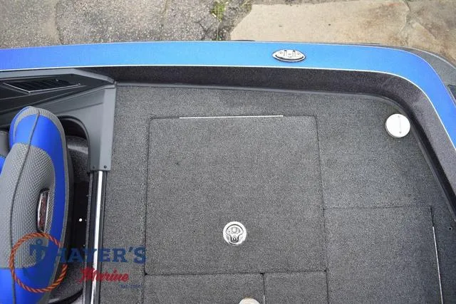 Slide: The Image of 2021 Ranger Z521L boat deck with blue trim and storage compartment. - 47