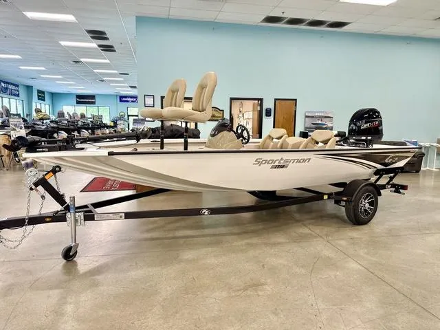 Slide: The Image of 2025 G3 Sportsman 1710 boat displayed indoors on a trailer. - 1