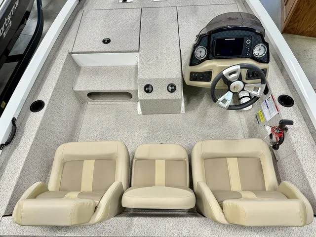 Slide: The Image of 2025 G3 Sportsman 1710 boat interior with beige seats and modern dashboard. - 3