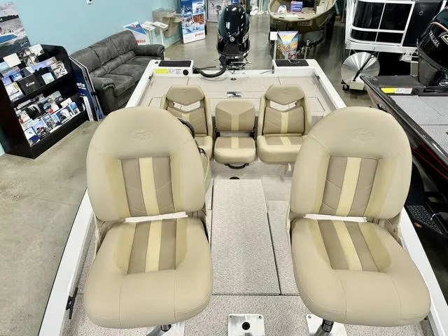 Slide: The Image of 2025 G3 Sportsman 1710 boat interior with beige seating and modern design. - 5