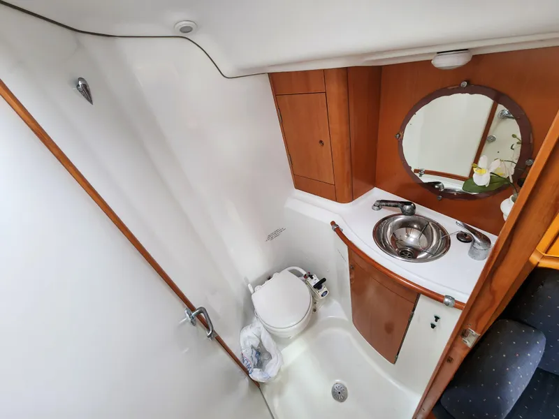 Slide: The Image of Bathroom interior of 2003 Beneteau First 40.7 yacht, featuring sink and toilet. - 16