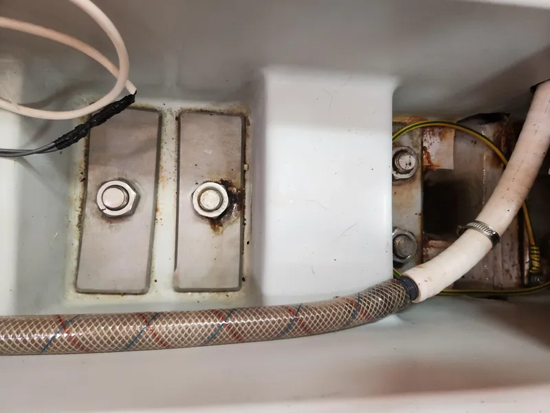 Slide: The Image of Bilge area of a 2003 Beneteau First 40.7 sailboat with visible hoses and fittings. - 25