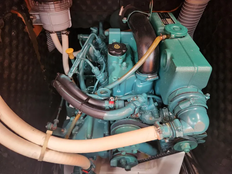 Slide: The Image of Engine of a 2003 Beneteau First 40.7 sailboat, showcasing intricate mechanical components. - 27