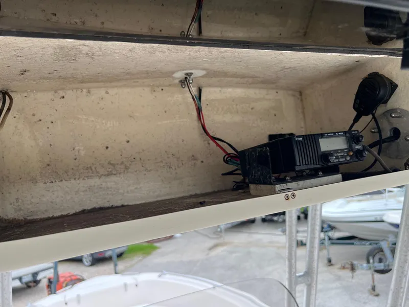 Slide: The Image of Interior view of a 1999 Grady-White 222 boat showing electronic equipment and wiring. - 16